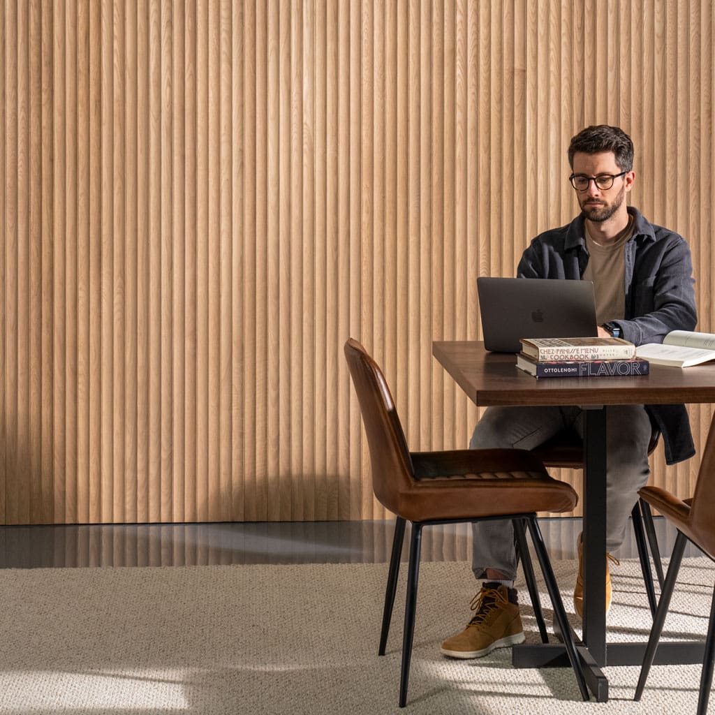Man Working in Front of Fluted Slat Solid Planks in White Oak