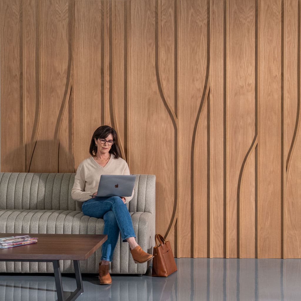 Women Working in Front of White Oak Tributary Dimensional Wall Panel